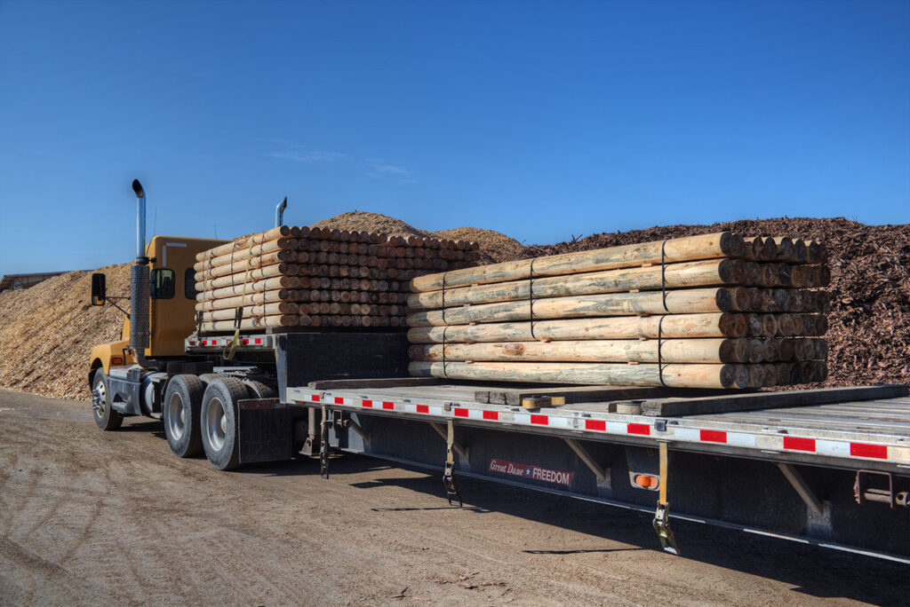 Peeled posts loaded on the truck to go to drying and treating