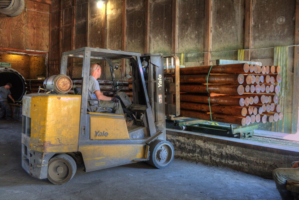 Treated posts being stacked